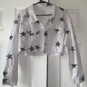 White denim cropped jacket with black stars